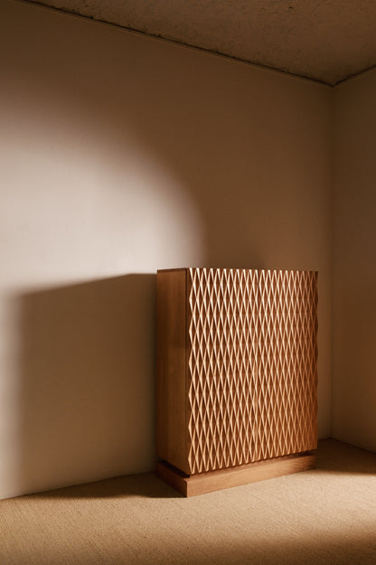 Cabinet 01 in solid oak, angled view of the cabinet in the corner