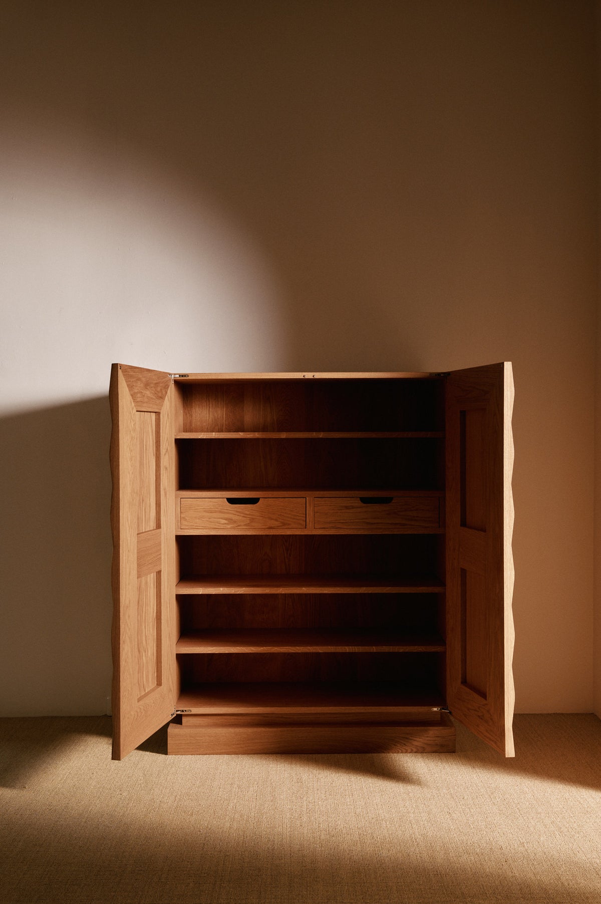 Cabinet 01 in solid oak, both doors open showing the shelves and drawer