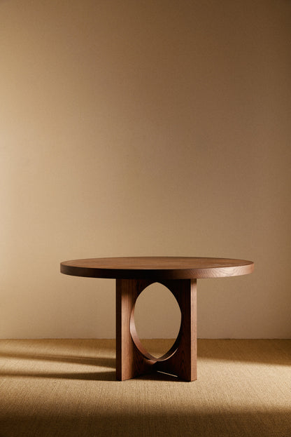 Moon Ronde round dining table in solid oiled oak, wide front view