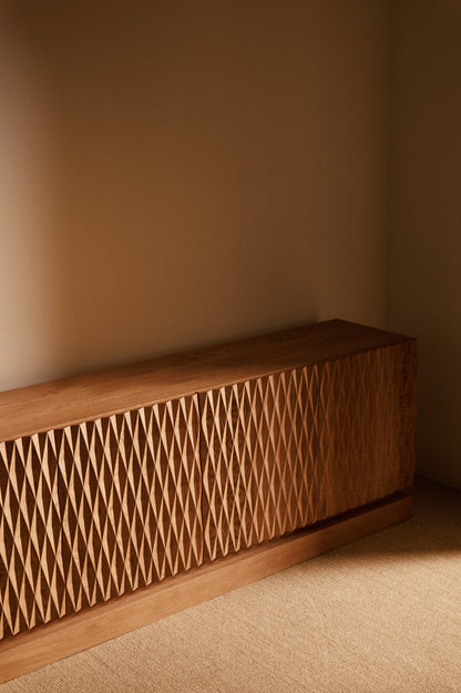 Sideboard 02 in solid oak, angled view of the diamond patterned doors