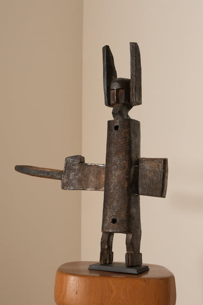 Bambara wood locker statue, angled view on a small stand