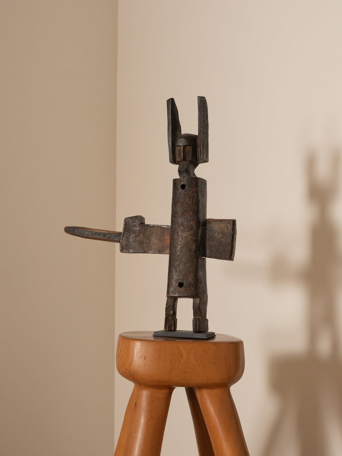 Bambara wood locker statue, wider angled view on a stool