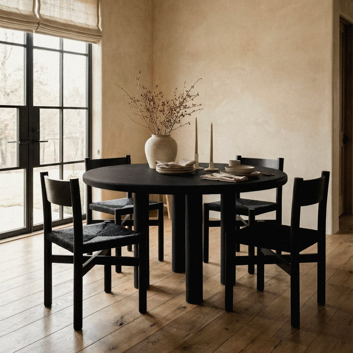 Nonna dining chair in black beside a dining table