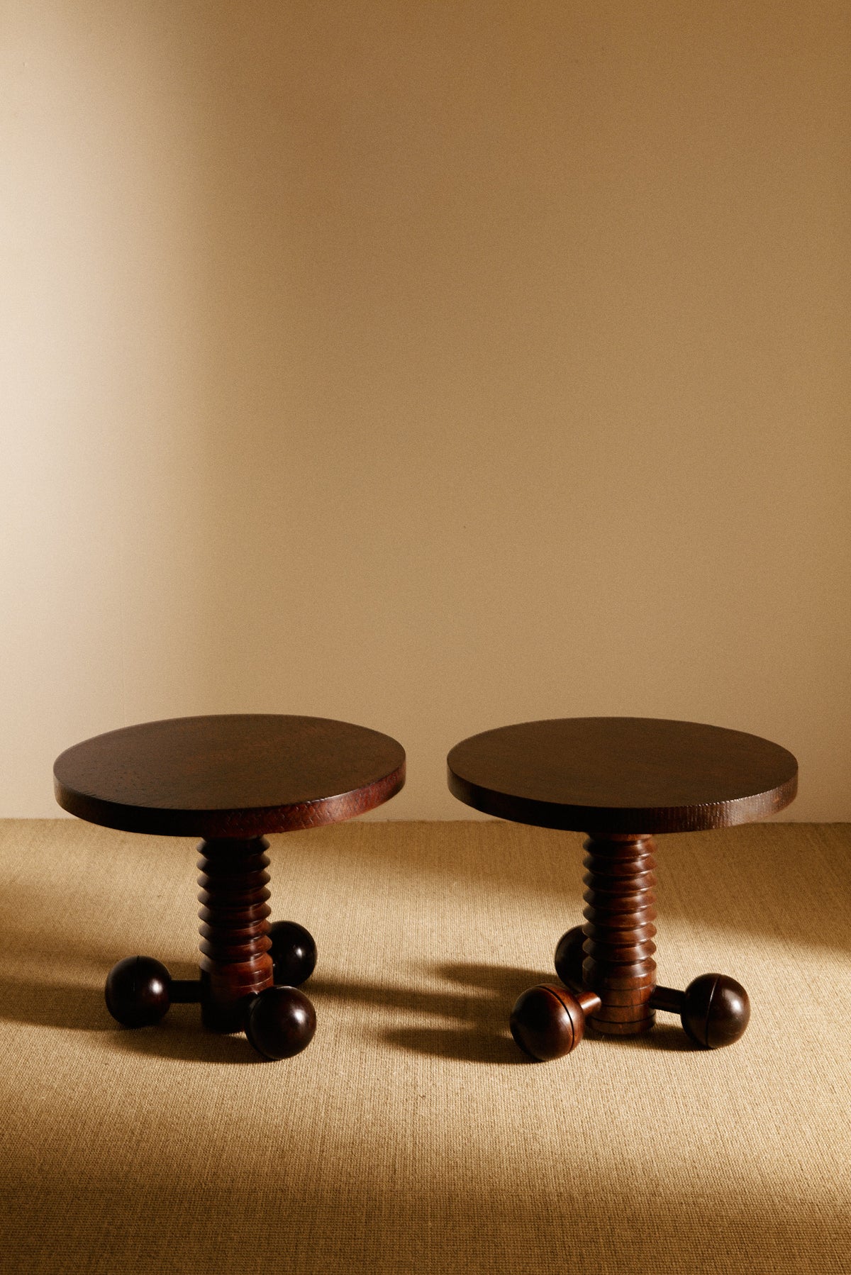 Charles Dudouyt patinated solid oak side table, two tables side by side, angled view