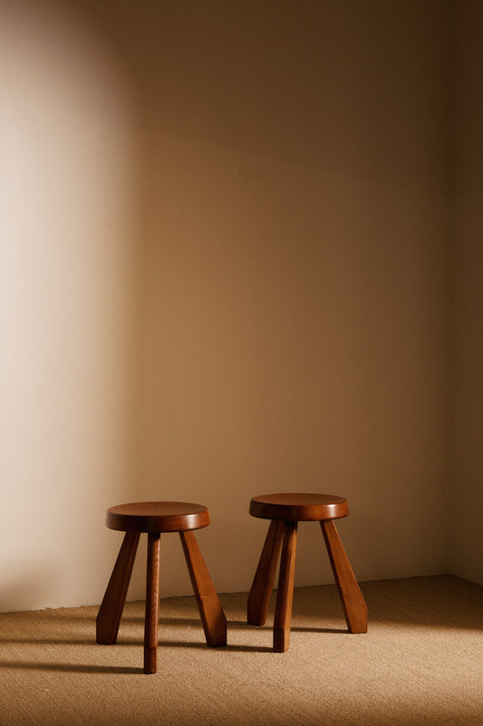 Charlotte Perriand pine Sandoz stools, pair in the corner of the room