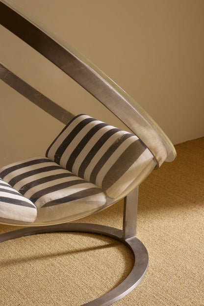 Christian Daninos Lucite and steel Bubble armchair, close view of the striped seat cushion