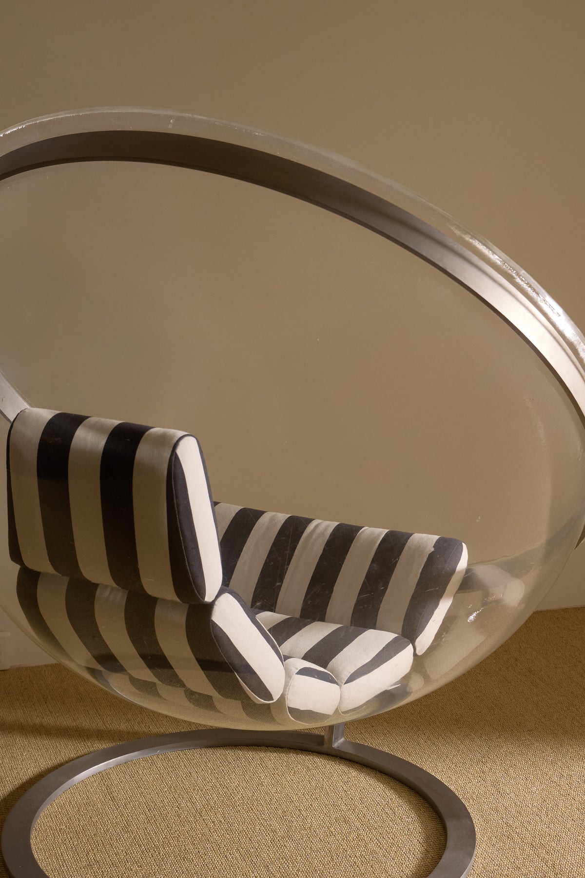 Christian Daninos Lucite and steel Bubble armchair, nearer view of the striped cushions inside the shell