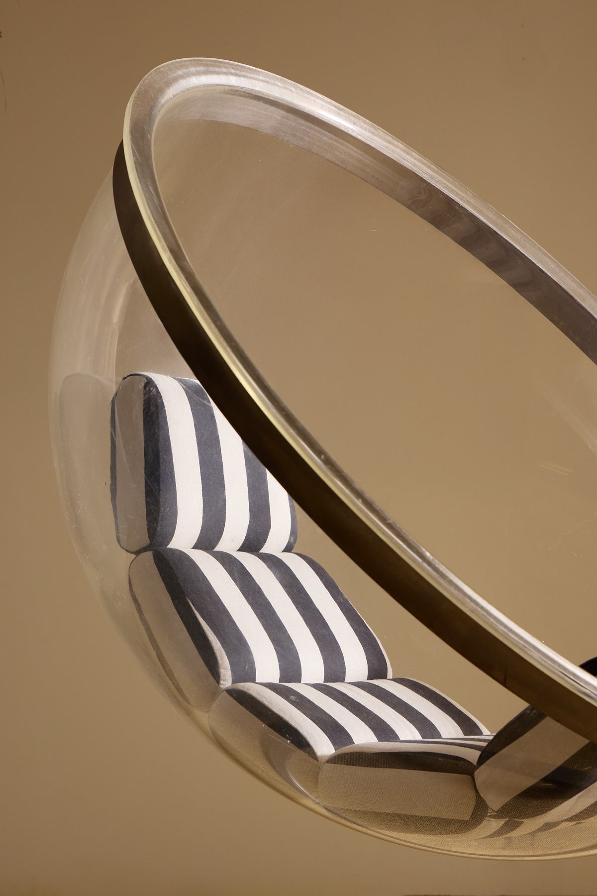 Christian Daninos Lucite and steel Bubble armchair, close view of the steel rim around the Lucite shell