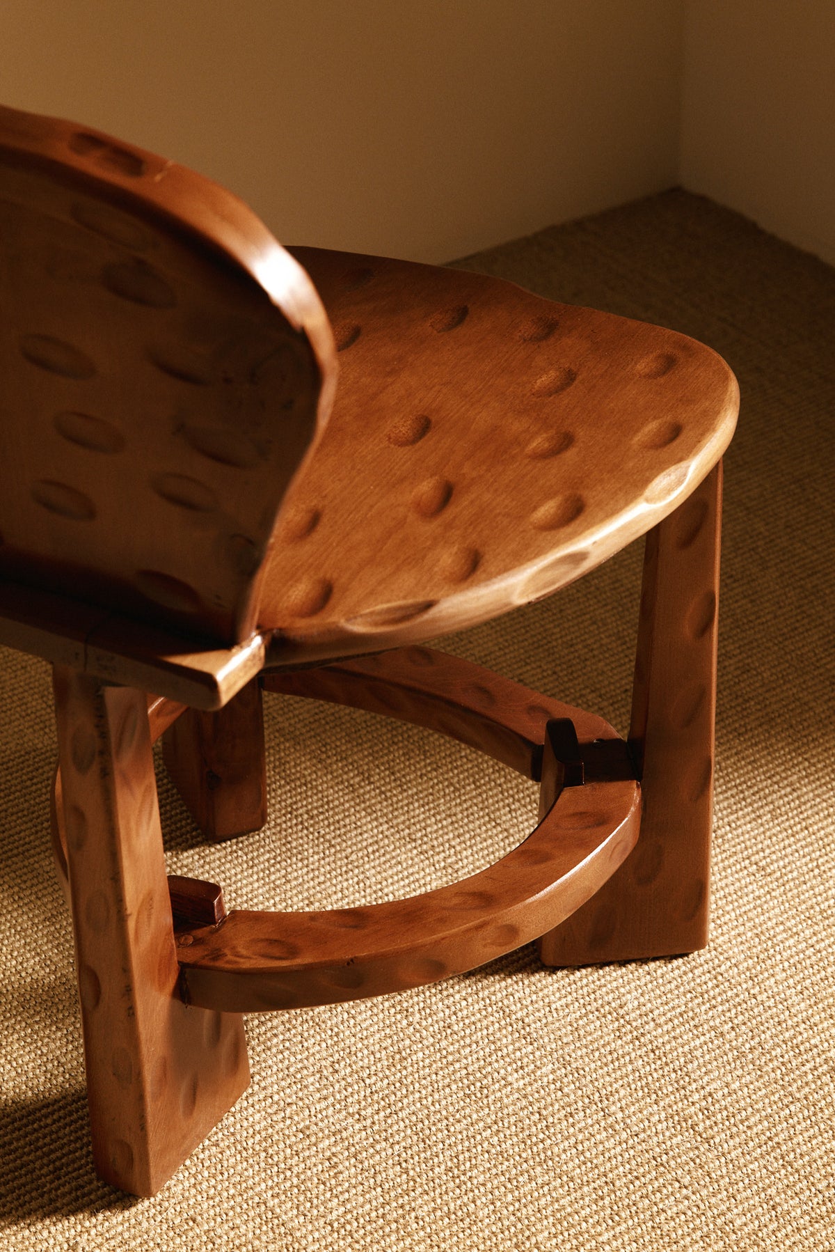 Pair of Dutch wood tripod chairs, close-up of the carved seat, back and base