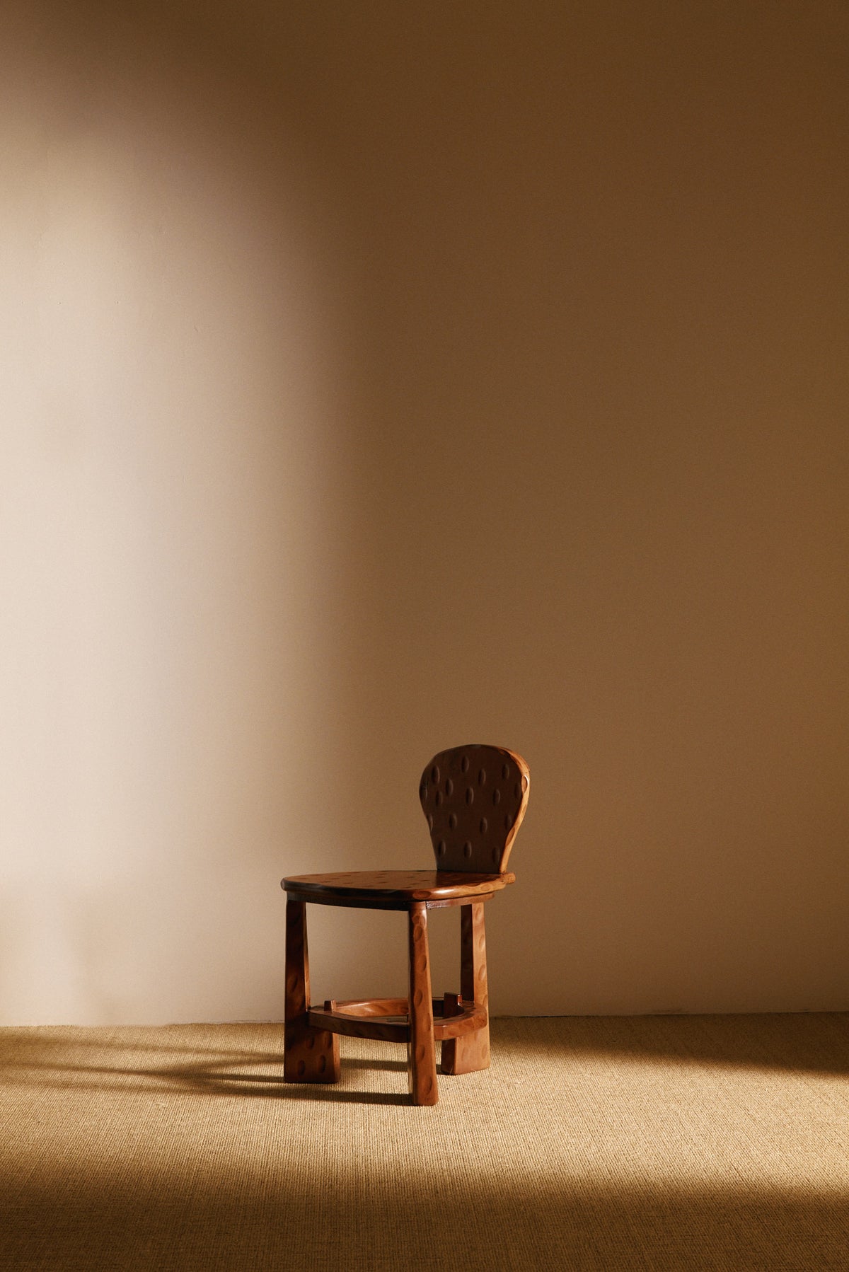 Pair of Dutch wood tripod chairs, single chair, angled view facing left