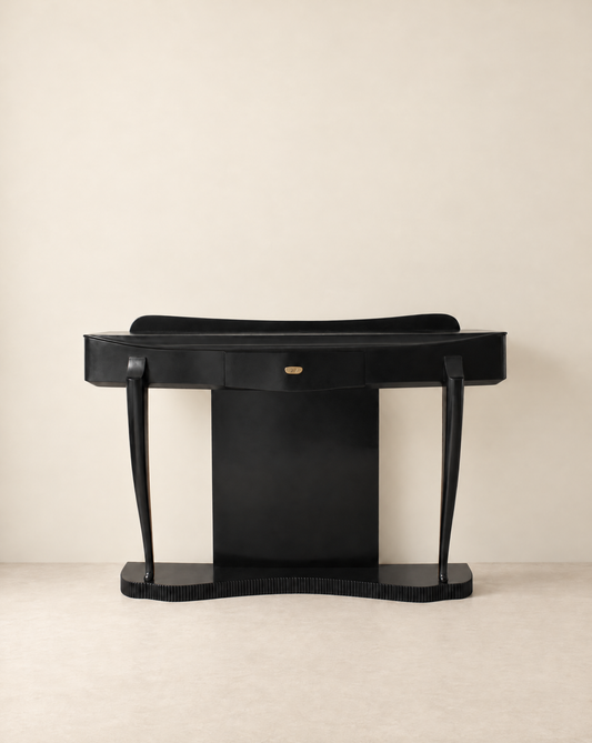 Ebonised Italian console table seen straight on against a pale wall