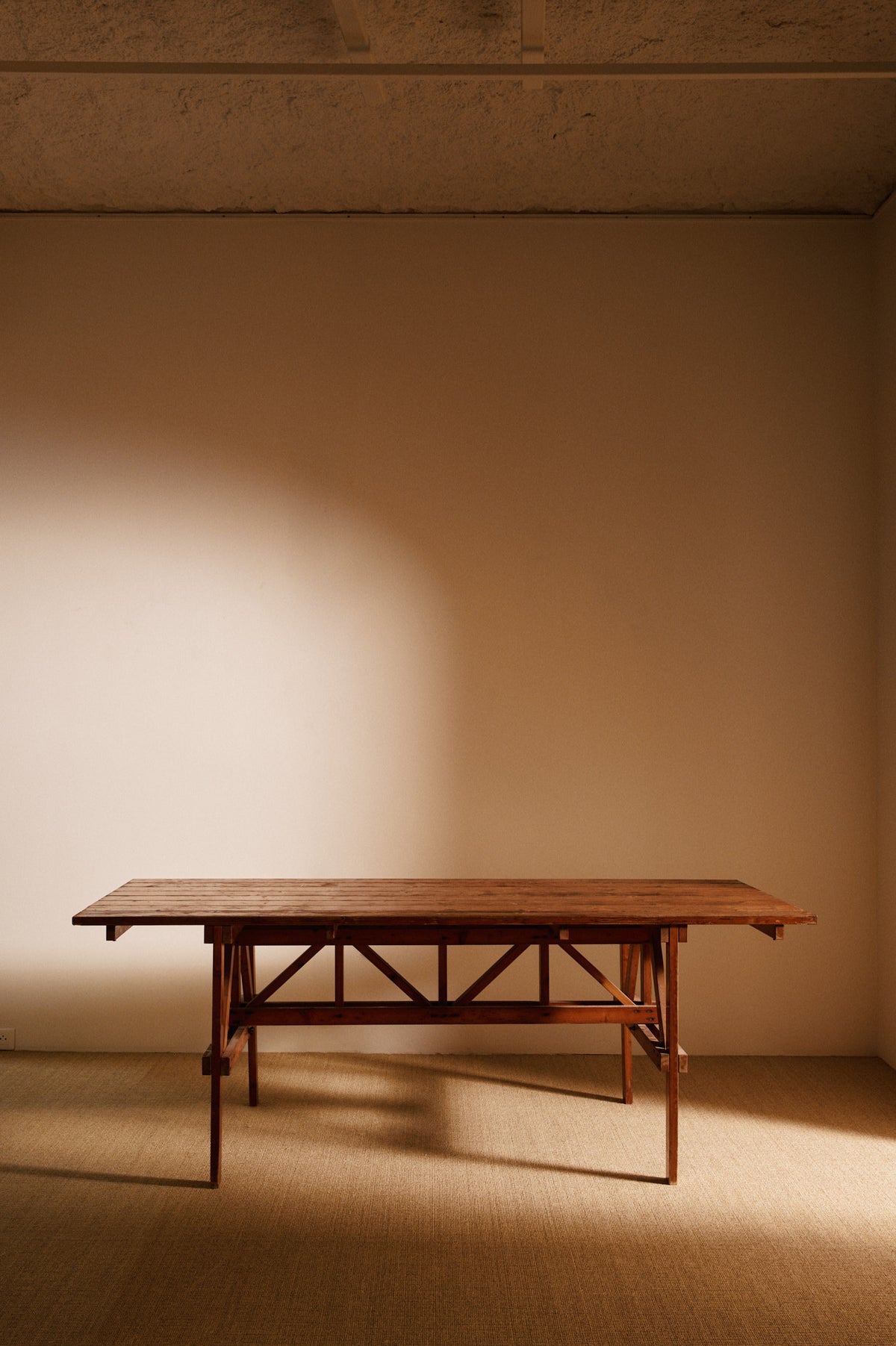 Enzo Mari natural pine Autoprogettazione dining table, front view of the table in the room