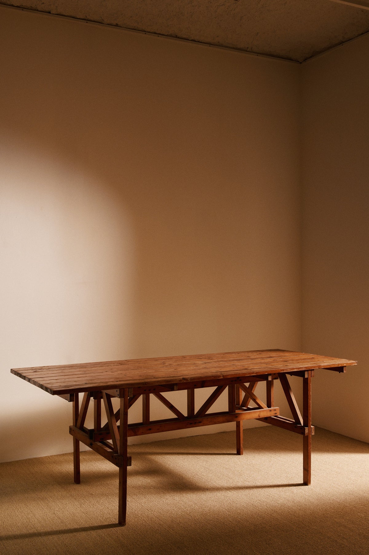 Enzo Mari natural pine Autoprogettazione dining table, low angled view along the long side