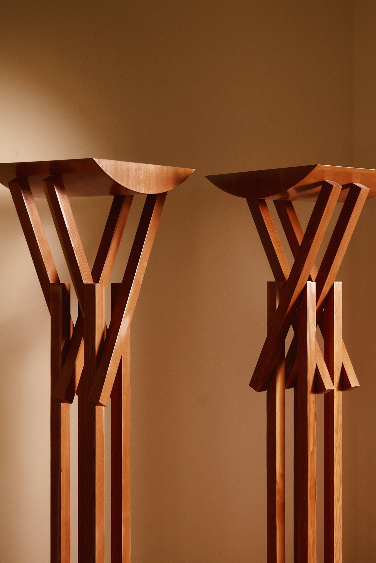 Frank Gehry patinated pine floor lamp, two lamps, nearer view of the upper struts and dishes
