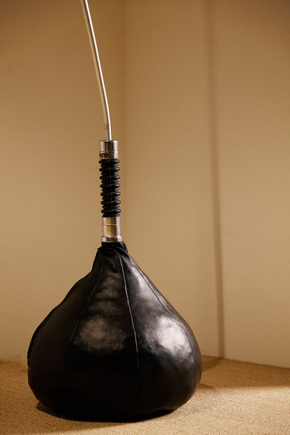Gabetti & Isola leather and metal floor lamp, close view of the leather base and ribbed collar