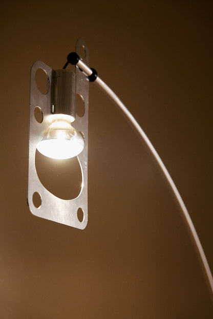 Gabetti & Isola leather and metal floor lamp, close view of the lit bulb and pierced plate