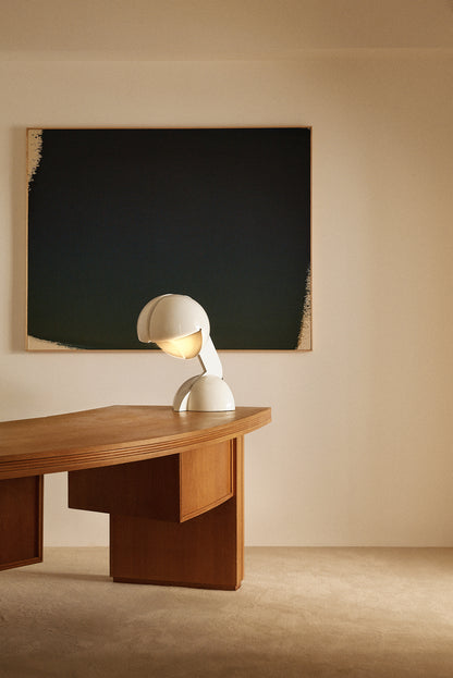 Gae Aulenti enameled aluminum Ruspa table lamp, wide view on the desk in the room