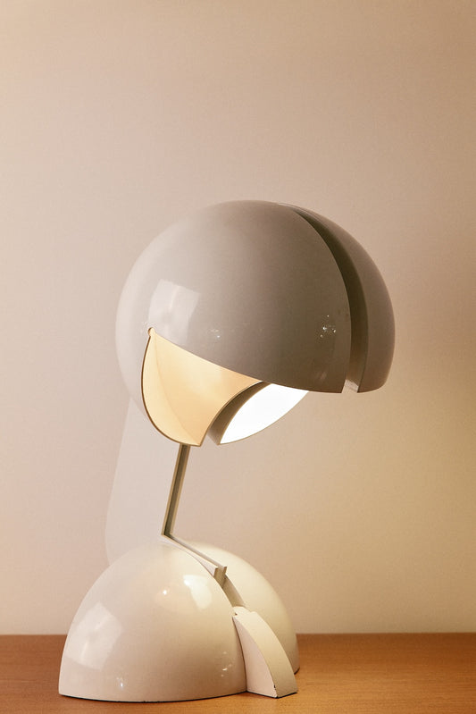 Gae Aulenti enameled aluminum Ruspa table lamp, front view of the hood on its domed base