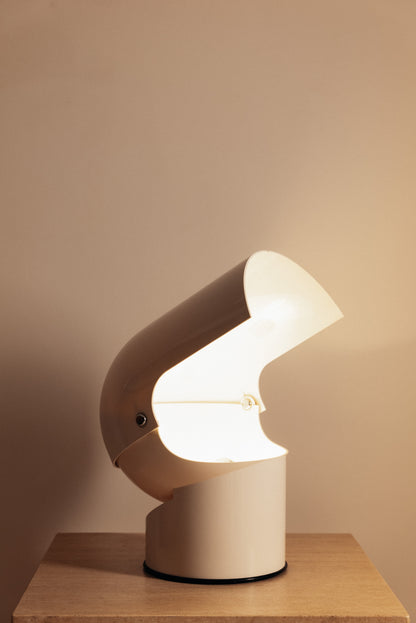 Gae Aulenti molded ABS Mezzo Pileo table lamp, hood raised high, lit