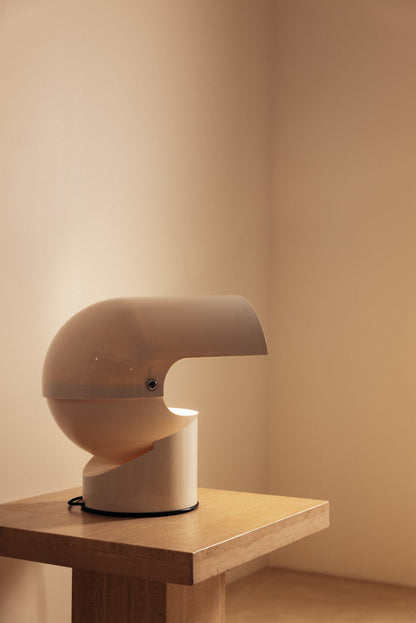 Gae Aulenti molded ABS Mezzo Pileo table lamp, on a stone topped table, hood open