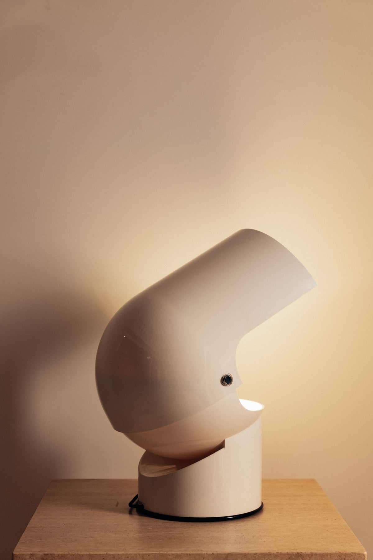 Gae Aulenti molded ABS Mezzo Pileo table lamp, hood tilted back