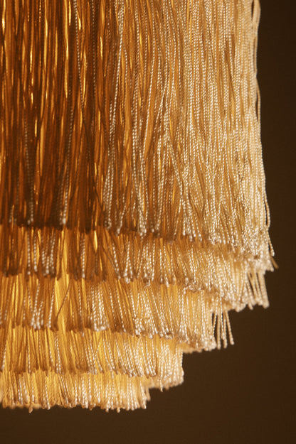 Hans Agne Jakobsson brass and silk pendant lights, close view of the tiers of silk fringe