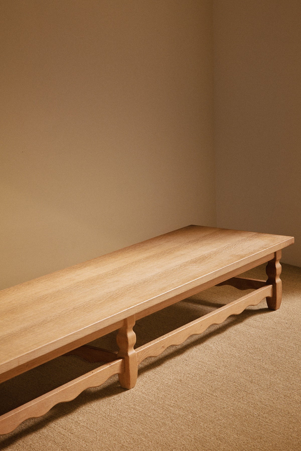 Henning Kjaernulf brushed oak coffee table, angled view along the length
