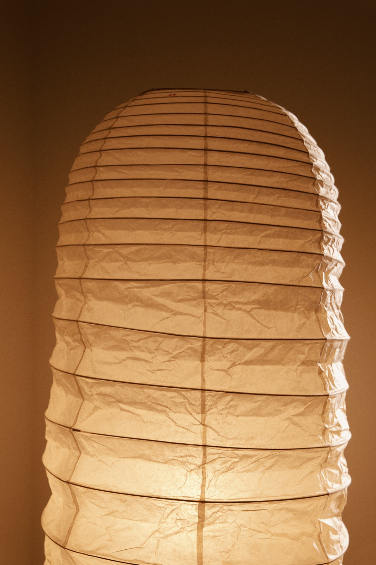 Isamu Noguchi Akari 32N floor lamp, paper shade lit, front view