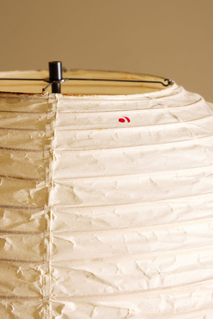 Isamu Noguchi Akari 32N floor lamp, close view of the paper shade with its red mark