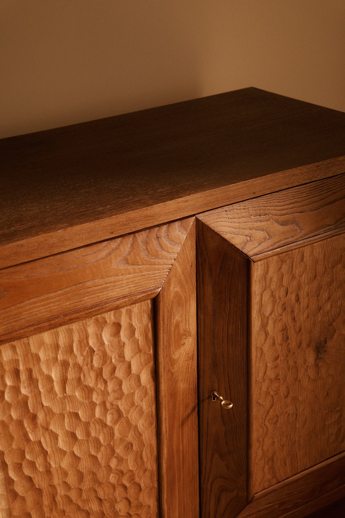 Italian hand carved wood sideboard, close-up of the carved doors