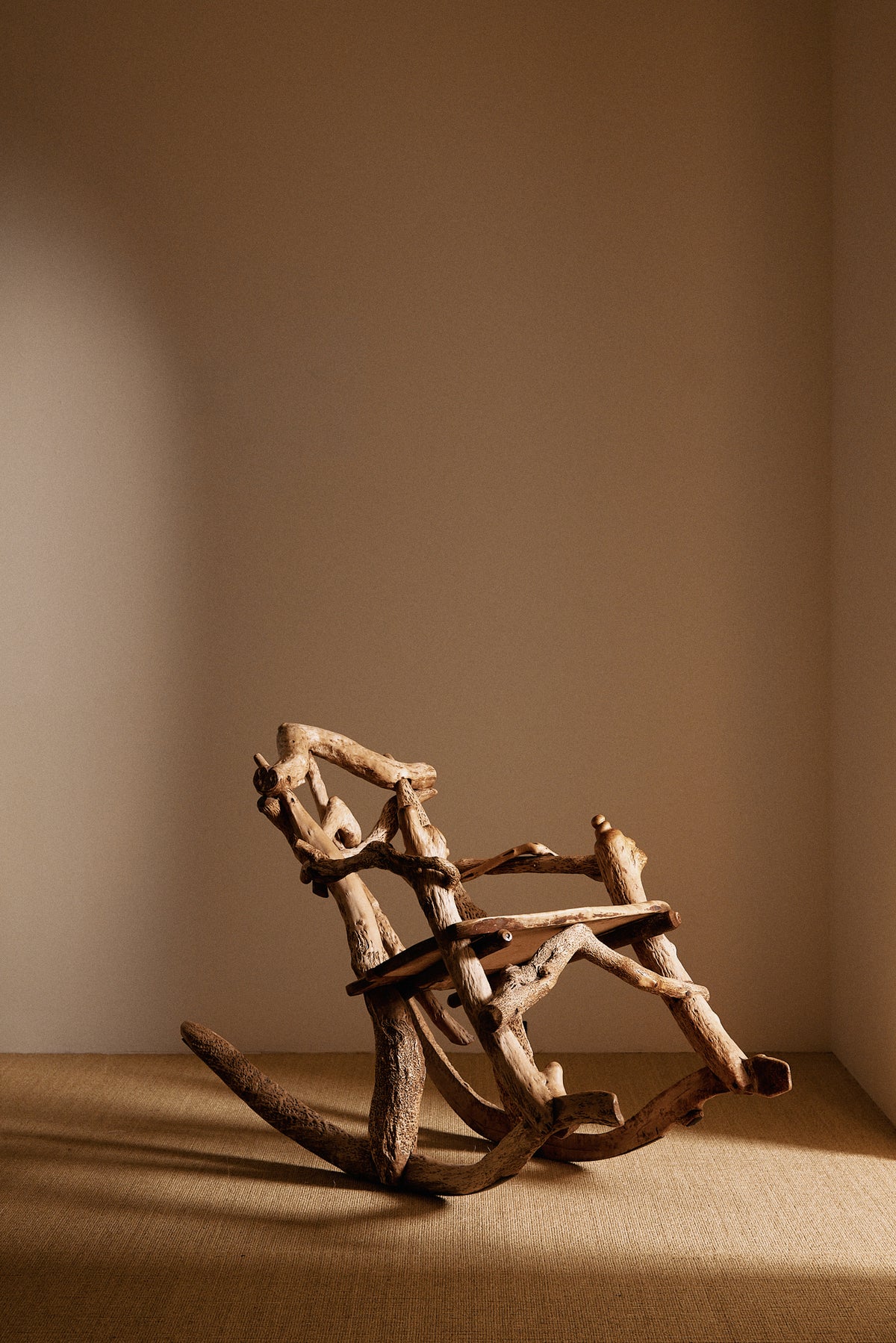 Matti Savijärvi tree root rocking chair, angled view