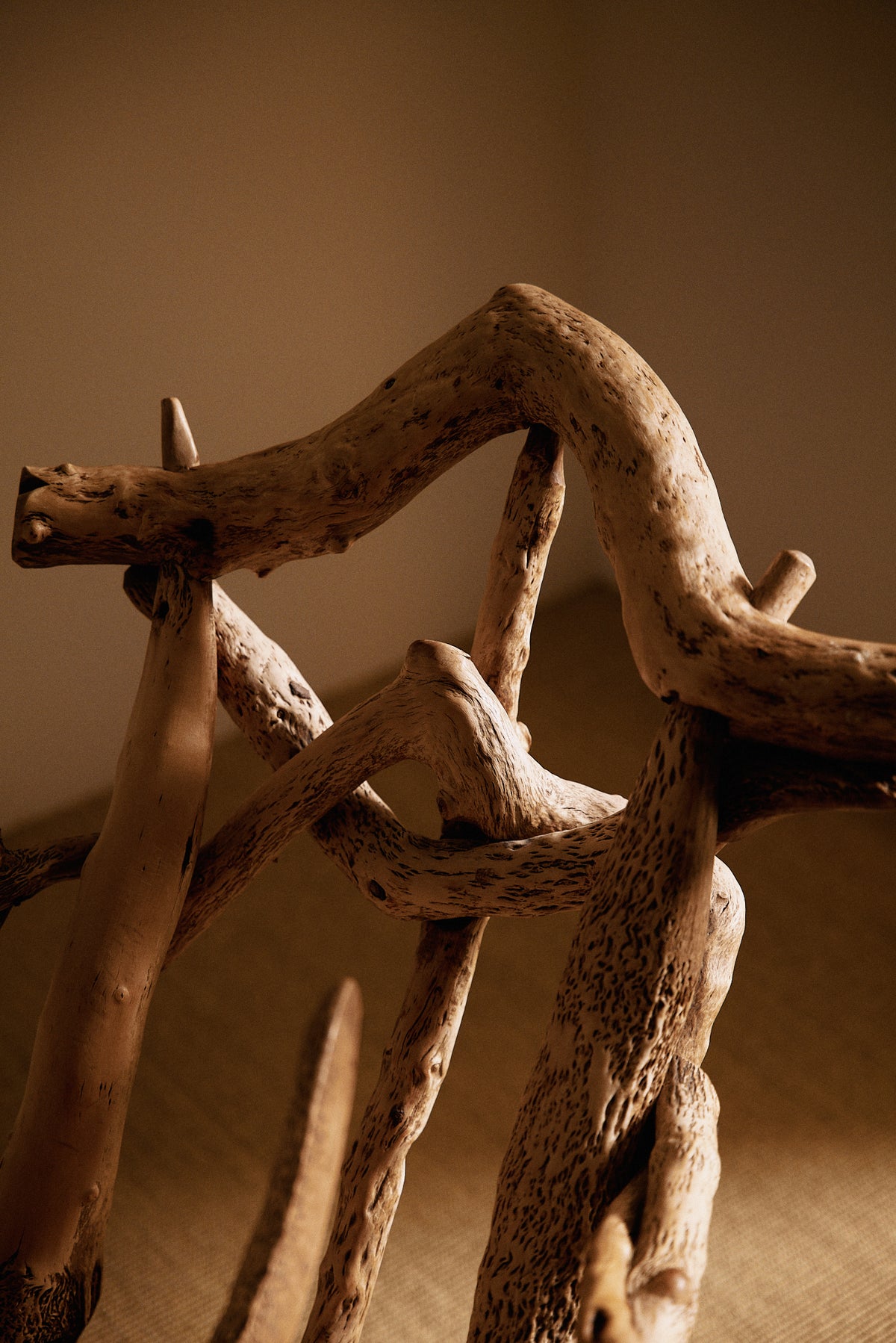 Matti Savijärvi tree root rocking chair, close view of the curved branch at the top of the back