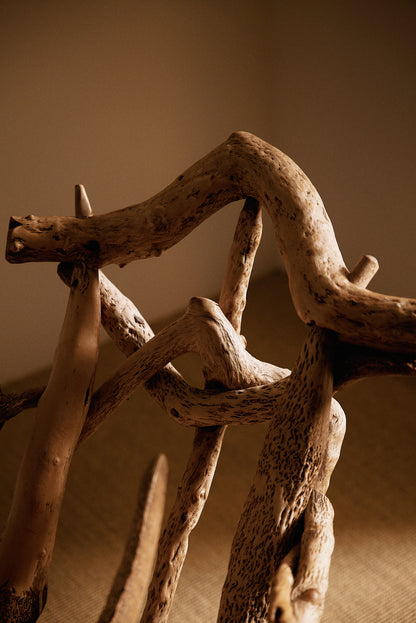Matti Savijärvi tree root rocking chair, close view of the curved branch at the top of the back