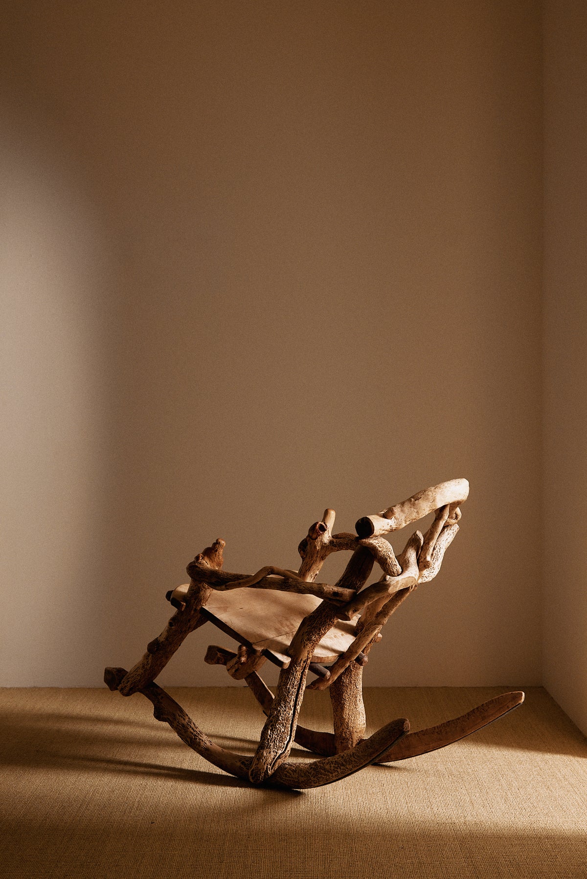 Matti Savijärvi tree root rocking chair, closer three quarter view