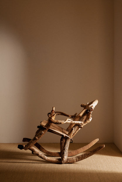 Matti Savijärvi tree root rocking chair, closer view with the chair rocked back