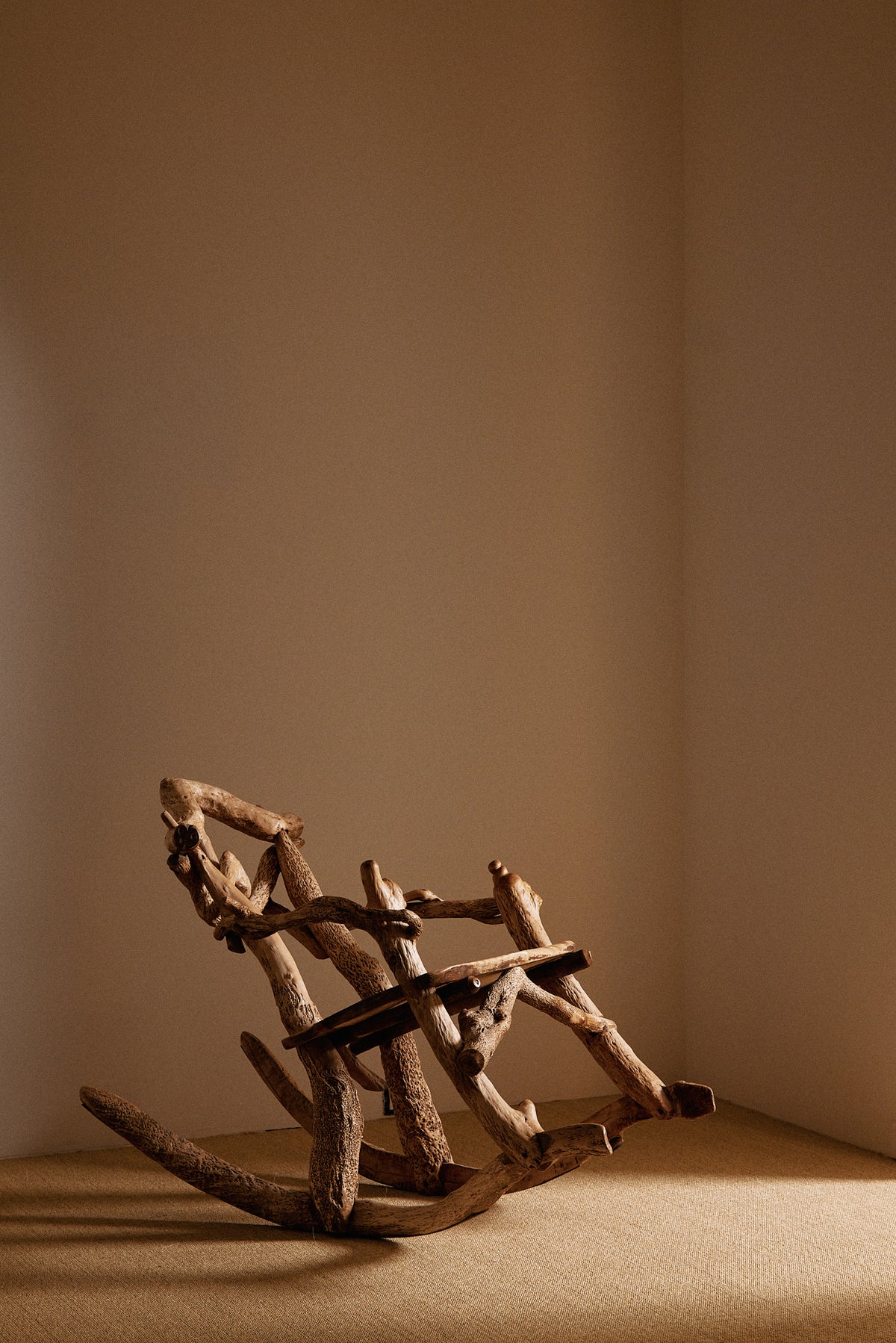 Matti Savijärvi tree root rocking chair, view with the chair rocked back
