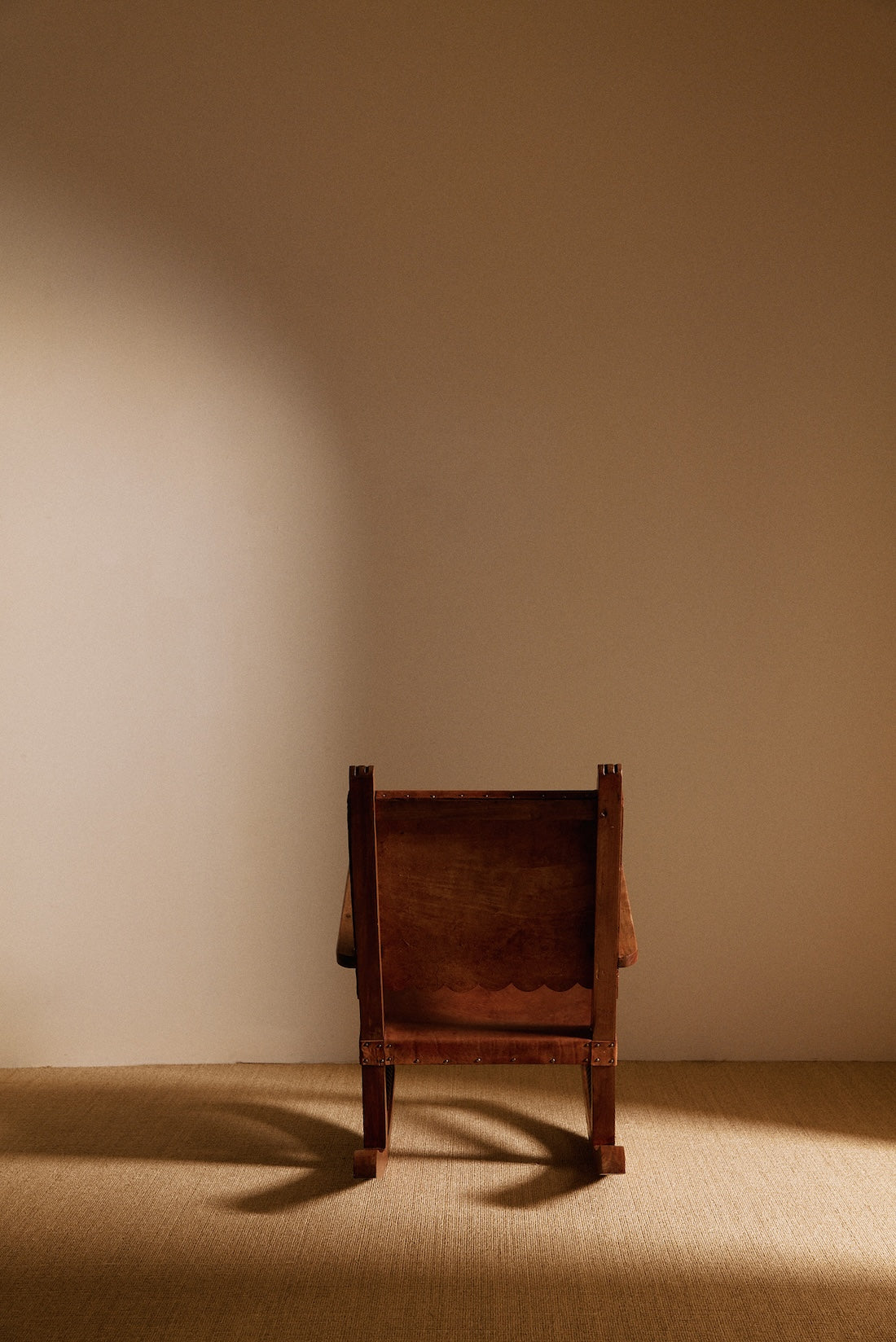 Mexican oak and tanned leather rocking chair, back view