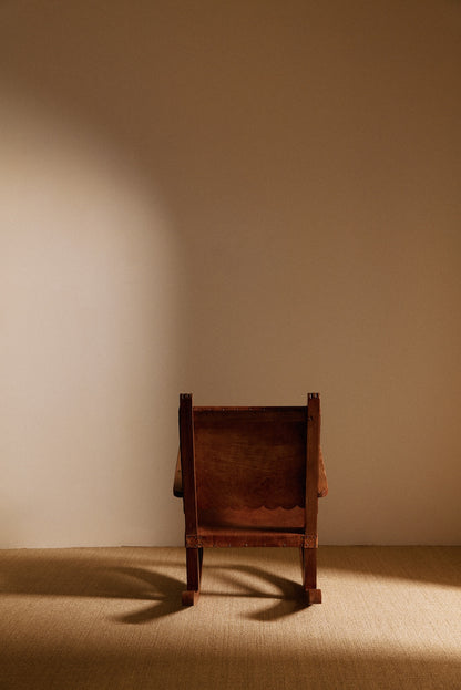 Mexican oak and tanned leather rocking chair, back view