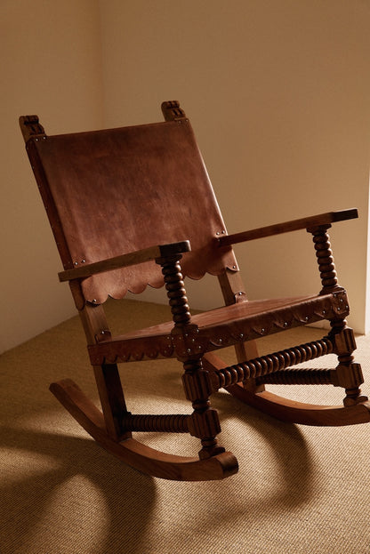 Mexican oak and tanned leather rocking chair, closer front angled view