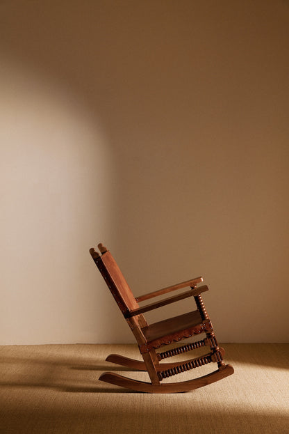 Mexican oak and tanned leather rocking chair front angled view