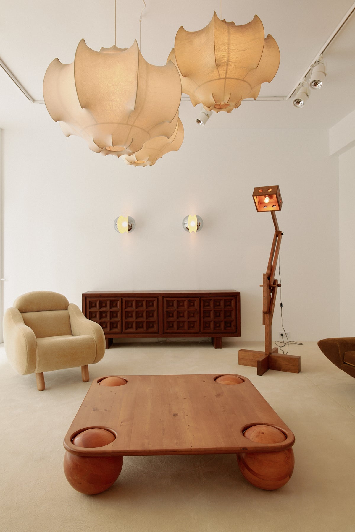 Gian Emilio, Piero & Anna Monti Diaframma polished steel and glass wall sconce, pair on the far wall of the room