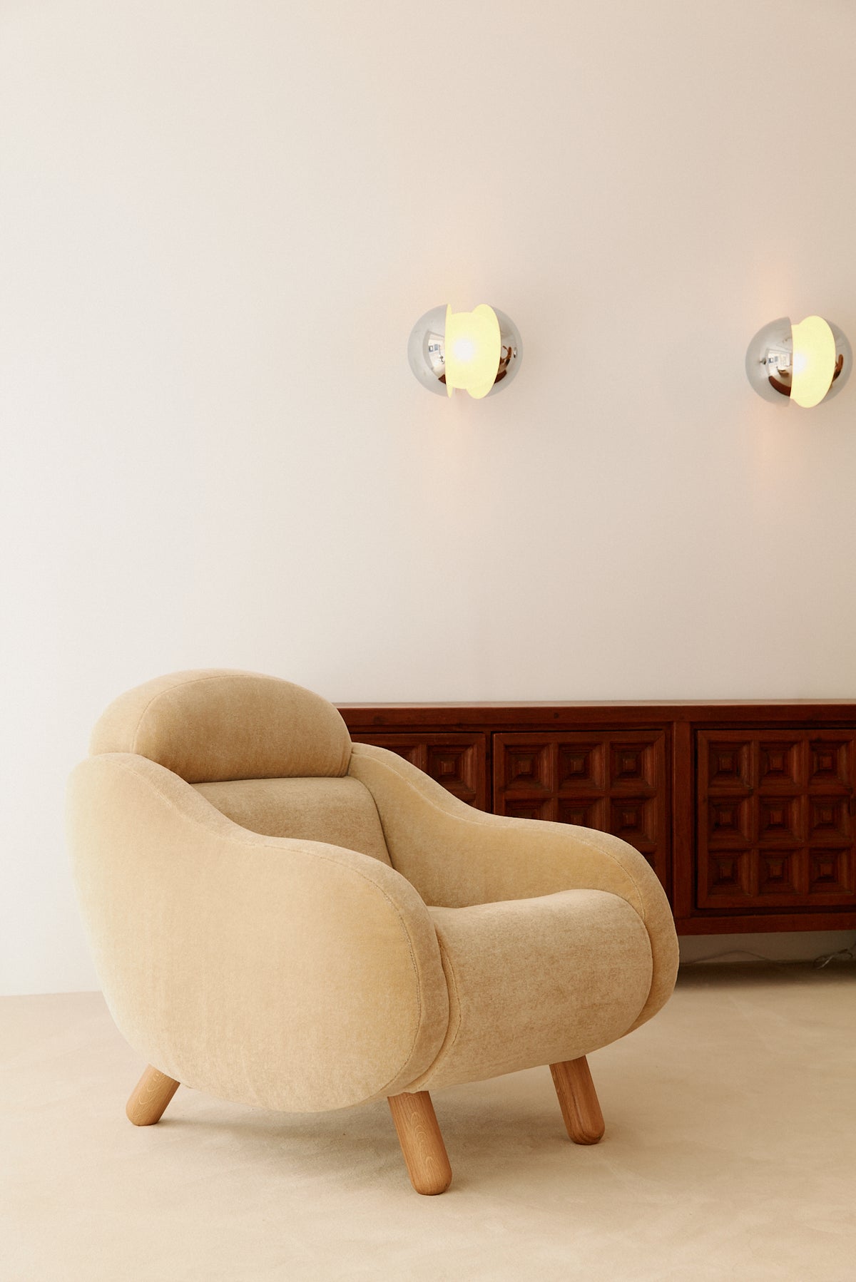 Gian Emilio, Piero & Anna Monti Diaframma polished steel and glass wall sconce, pair on the wall above an armchair and sideboard