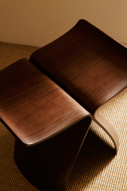 Pair of Sori Yanagi molded rosewood Butterfly stools, close-up of the molded seat