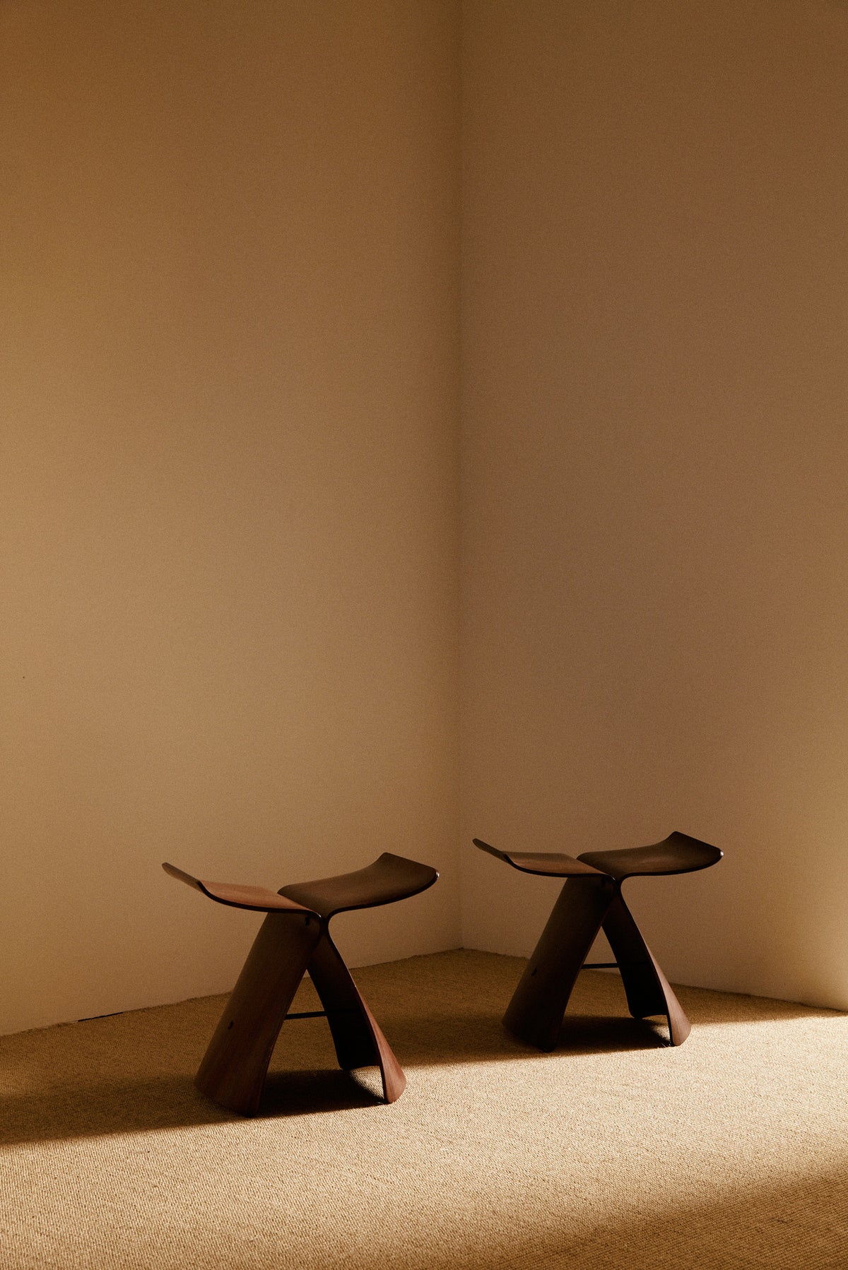 Pair of Sori Yanagi molded rosewood Butterfly stools view of the pair
