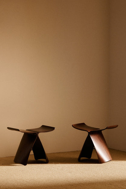 Pair of Sori Yanagi molded rosewood Butterfly stools, wide view of the pair