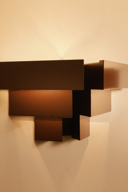Stepped plate wall sconces, close view of the stepped plates