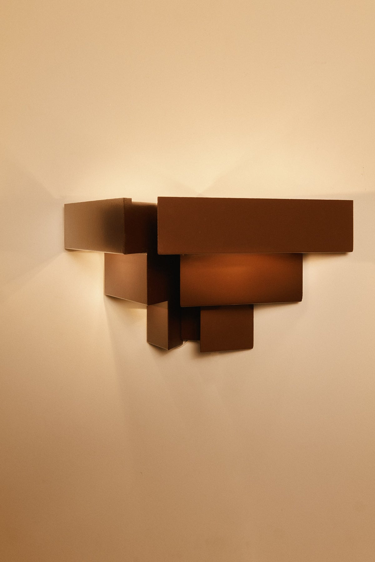Stepped plate wall sconces, single sconce, angled view