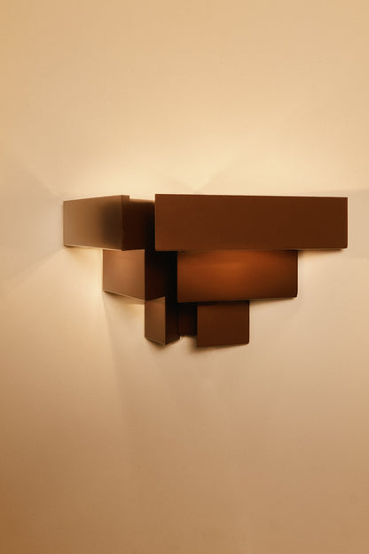 Stepped plate wall sconces, single sconce, angled view