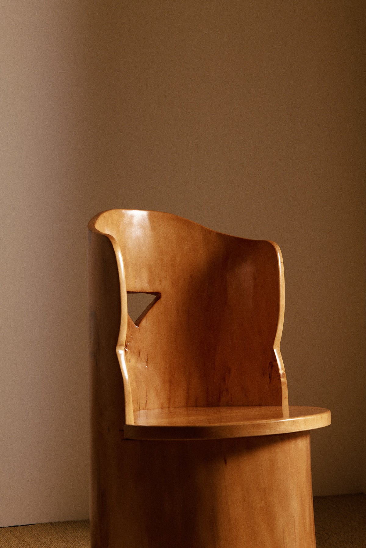 Swedish sculptural pine armchair angled close view
