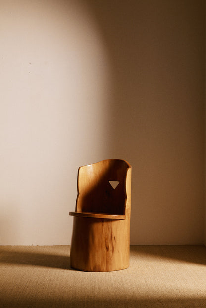 Swedish sculptural pine armchair, closer angled front view